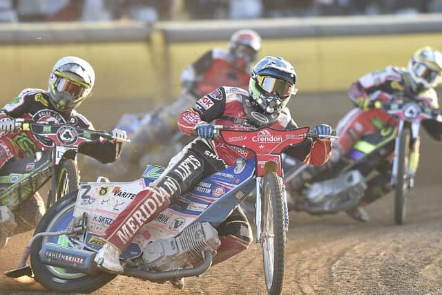 Hans Andersen (blue helmet) in action during a top-scoring display for Panthers against Belle Vue. Photo: David  Lowndes.