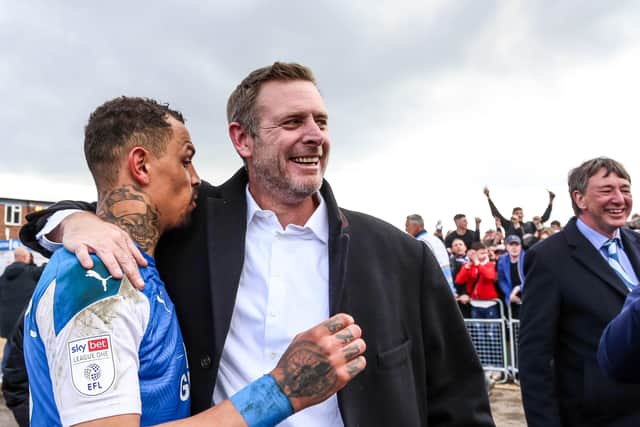 Posh co-owner Darragh MacAnthony (right) with star striker Jonson Clarke-Harris.