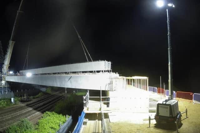 The beams are lifted into place