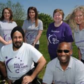 Organisers of the Peterborough Relay for Life with Deljit Singh -   Sharon Clapham, Sarah Sindall, Lisa McLoughlin, Tracey Yearwood and Jason Yearwood. pictured at the race venue at Ferry Meadows. EMN-210529-155120009