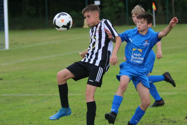 Action from the Under 12 League Cup Final between Peterborough Northern Star and Yaxley (blue). Photo: RWT Photography.