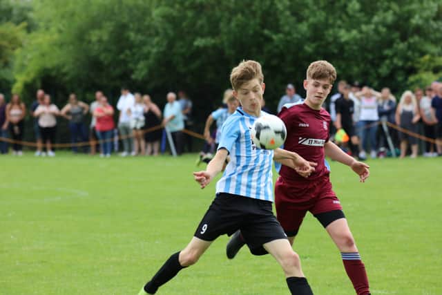 Action from the Under 13 League Cup Final between Werrington (blue) and Bourne. Photo: RWT Photography.