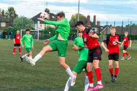 Action from Netherton United Under 18s (red) JPL title play-off defeat at the hands of Dereham.