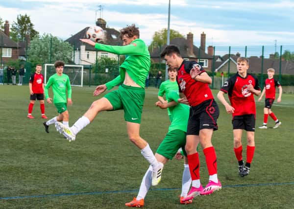 Action from Netherton United Under 18s (red) JPL title play-off defeat at the hands of Dereham.