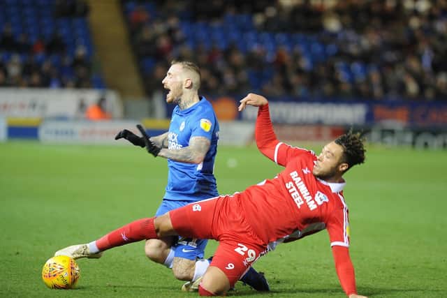 Marcus Maddison in action for Posh.