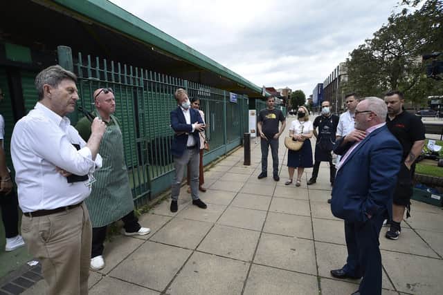 The meeting between the politicians and market traders