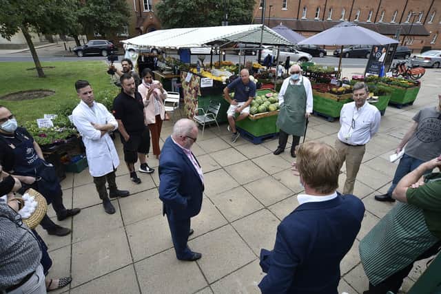 The meeting between the politicians and market traders