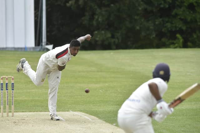 Abdul Qader bowling for Oundle Town against Peterborough Town. Photo: David Lowndes.