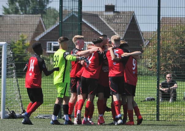 Netherton celebrate their second goal in the JPL National Under 18 semi-final at the Grange. Photo: David Lowndes.