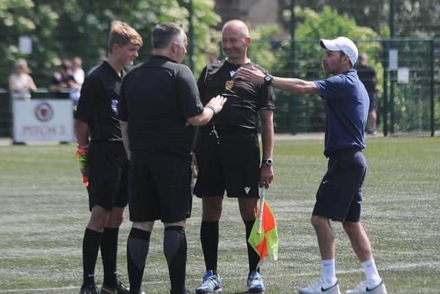Yaxley Under 18s manager Danny Clifton argues with referee Paul Gale and his assistants. Photo: David Lowndes.