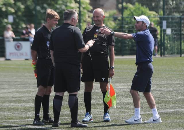 Yaxley Under 18s manager Danny Clifton argues with referee Paul Gale and his assistants. Photo: David Lowndes.