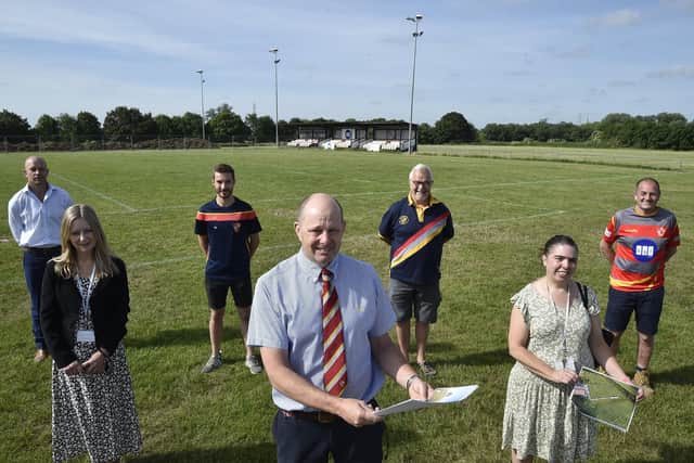 Peterborough Rugby Union Football Club president Andrew Burgess (centre) with Councillors Jackie Allen and Samantha Hemraj, former player Neil Duffield from London Rock, Tom Downer, Ian Hamilton and Archie Bennett from the club at the launch of new improvement plans for the venue.