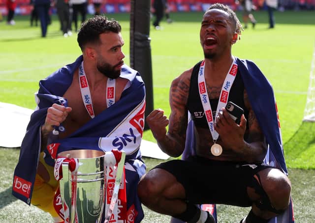 David Raya and Ivan Toney celebrate with the trophy after the Sky Bet Championship Play-off Final (Photo by Catherine Ivill/Getty Images)