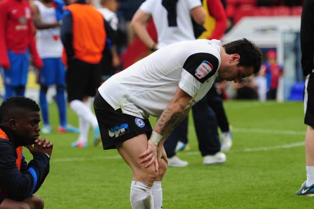 A dejected Lee Tomlin after Posh are relegated from the Championship following their 3-2 defeat at Crystal Palace in 2013.