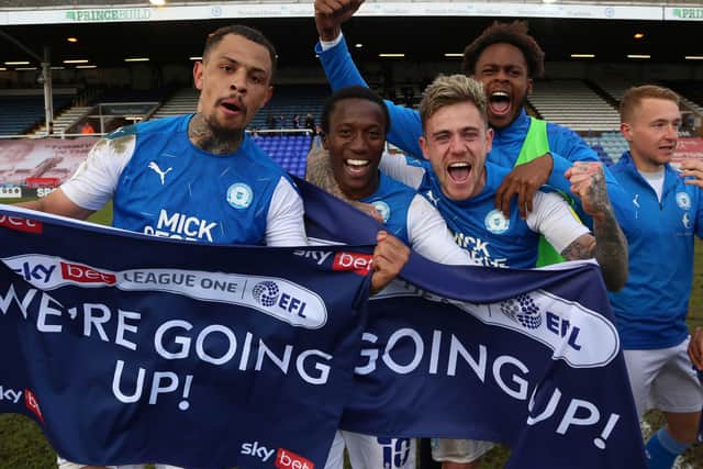 Peterborough United players celebrate winning promotion - Mandatory by-line: Joe Dent/JMP.
