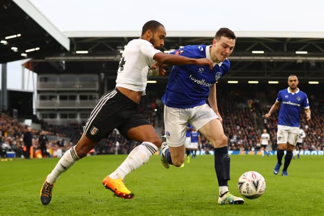 George Edmundson battles for the ball against Fulham in the FA Cup (Photo by Clive Rose/Getty Images)
