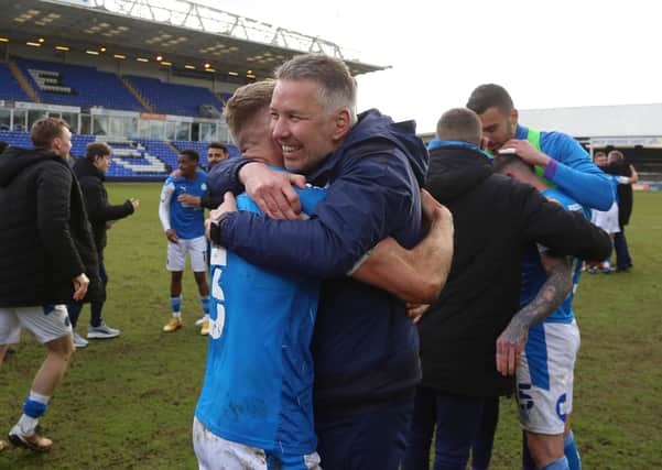 Peterborough United Manager Darren Ferguson celebrates winning promotion with Dan Butler - Mandatory by-line: Joe Dent/JMP.