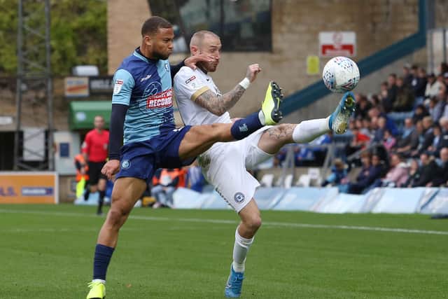 Marcus Maddison battles with Curtis Thompson of Wycombe. Photo: Joe Dent/JMP.