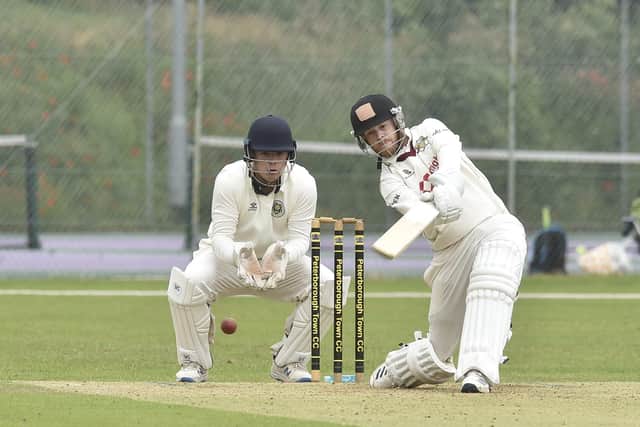 Mark Edwards hits out in his innings of 39 not out for Peterborough Town against Cambridge CC. Photo: David Lowndes.