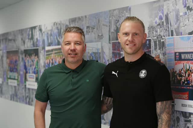 David Cornell (right) with Posh manager Darren Ferguson.