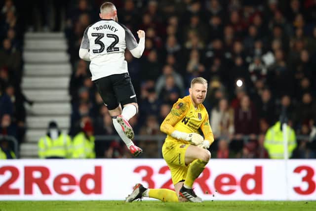 Wayne Rooney celebrated after scoring past Cornell in the EFL Cup (Photo by Mark Thompson/Getty Images)