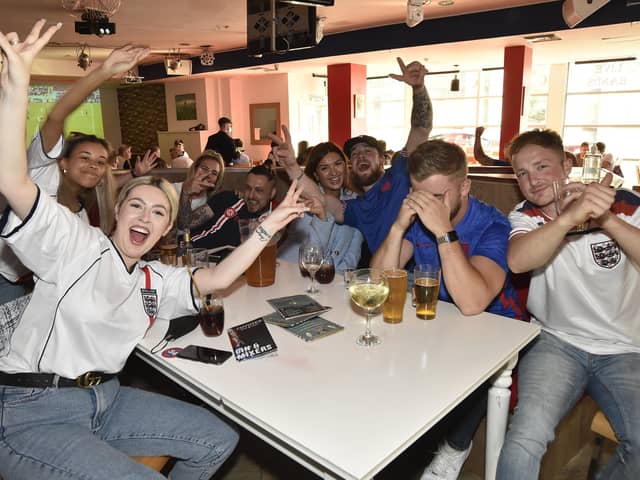 England fans at the Coyotes Bar, New Road, Peterborough EMN-210629-193348009