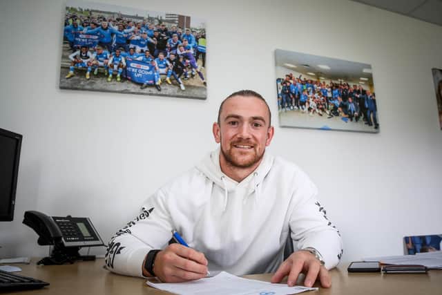 Jack Marriott signs his new contract. Photo: Joe Dent/theposh.com.