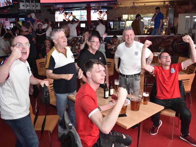 England football fans watching the Ukraine game at  Coyotes Bar and Grill at New Road EMN-210307-221051009