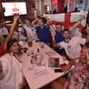 England football fans watching the Ukraine game at  Coyotes Bar and Grill at New Road EMN-210307-221325009