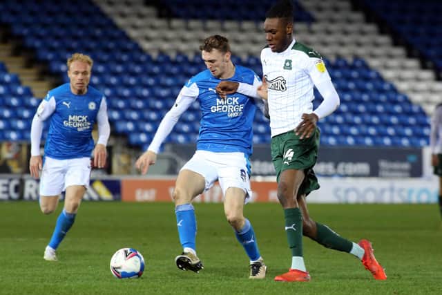 Jack Taylor (left) in action for Posh.