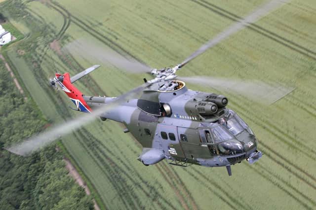 A 50th Anniversary Puma helicopter flies over the Oxfordshire countryside on 2nd July 2021.As part of the Puma 50th anniversary celebrations and commemorations, Puma HC Mk 2 XW224 has been re-painted in a unique paint scheme.  The aircraft scheme is similar to that which the first aircraft were painted when they were delivered in 1971 but with several notable differences. The engine housing boasts the badges of all squadrons who have flown the Puma, both as a HC Mk 1 and a HC Mk 2.  The tail fin is also emblazoned with the union flag.  On the cabin door, the standard Royal Air Force logo has been replaced with the bespoke Puma 50 logo and the cockpit door is annotated with the name of the first Squadron Commander who brought the aircraft into operational service.