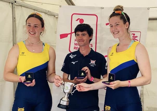 Henley Regatta winners Harriet Drake-Lee (left) and Charlotte Bolton (right) with coach Oliver James.