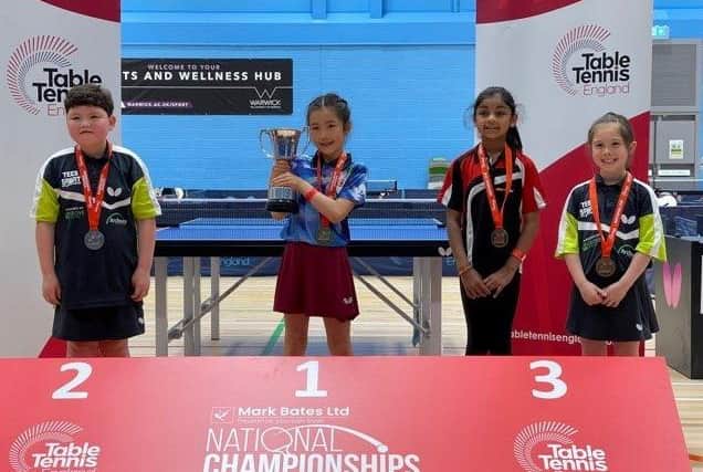 Amber Lemmon (2) and Hannah Saunders (3) with their medals from the English Junior Championships.