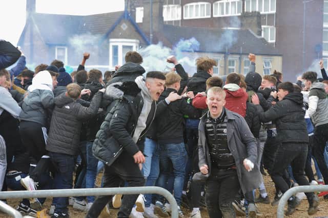 Posh fans celebrate outside the Weston Homes Stadium after promotion back to the Championship was clinched.