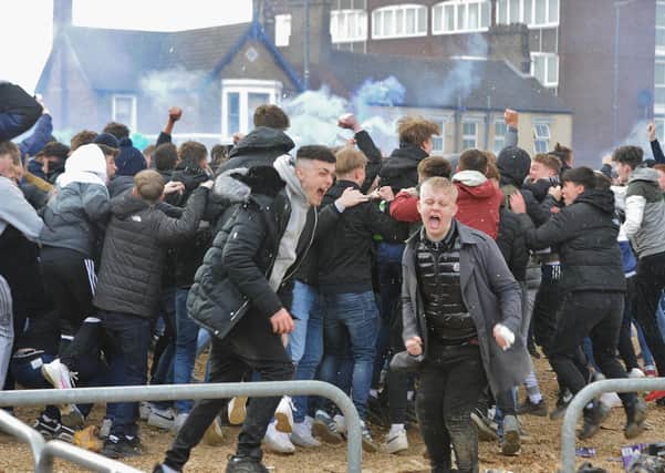 Posh fans celebrate outside the Weston Homes Stadium after promotion back to the Championship was clinched.
