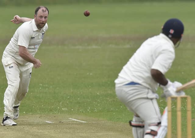 Jon Dee bowling for Hampton against Ickwell. Photo; David Lowndes.