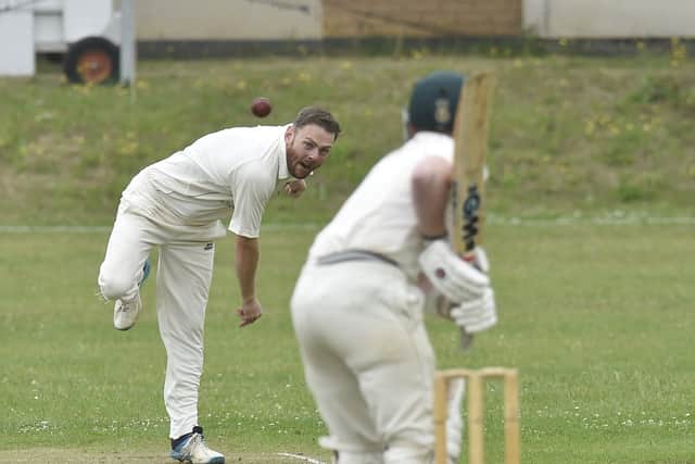 Connor Moyle bowling for Hampton against Ickwell. Photo; David Lowndes.