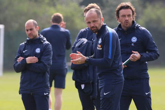 Matthew Etherington (foreground) and Simon Davies (right) working with Posh under 18s.