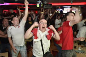 England fans watching the Euro 20 semi-final at the Coyotes Bar and Grill at New Road, Peterborough EMN-210707-230738009