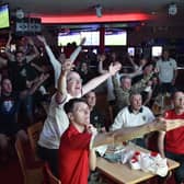 England fans watching the Euro 20 semi-final at the Coyotes Bar and Grill at New Road, Peterborough EMN-210707-231034009