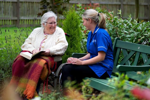 A Caremark staff member chats to a client.