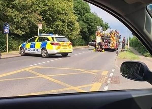 Emergency service attend the scene along Whittlesey Road.