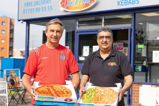 Stef Malajny and Vic Curry with English pizza and Italian pizza.
Photo: Terry Harris THA