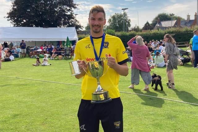 Josh Smith of Peterborough Town with the Northants Championship T20 Final man-of-the-match prize.