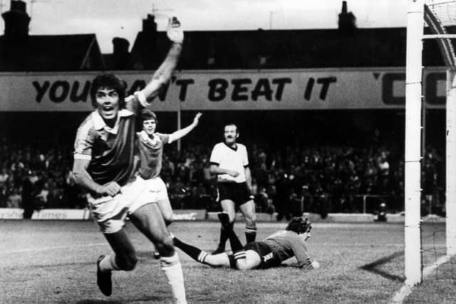 Ernie Moss celebrates a goal.