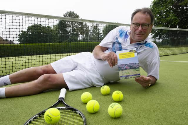 Ashley Martin with his book on the Hunstanton tennis tournament.