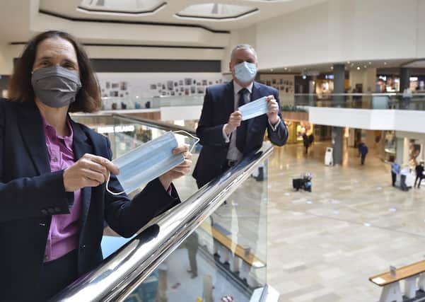 Mark Broadhead, Queensgate Centre manager, with Dr Liz Robin, the former Cambs and Peterborough CC  Director of Public Health, highlighting the importance of face masks at the height of the pandemic.