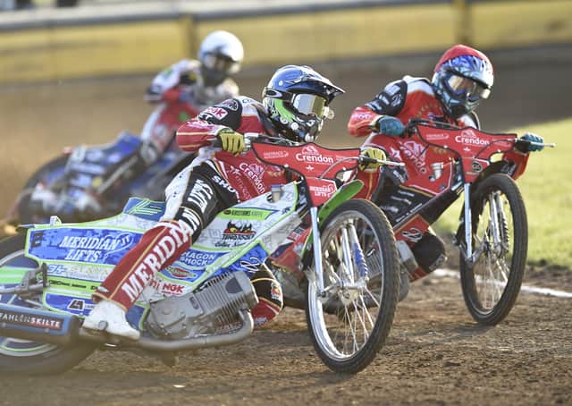 Ulrich Ostergaard (red) and Hans Andersen (blue) take a 5-1 for Panthers in Heat 1 against Belle Vue. Photo: David Lowndes.