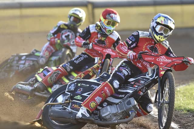 Scott Nicholls (blue) and Michael Palm Toft (red) racing in Heat 3 for Panthers against Belle Vue. Photo: David Lowndes.