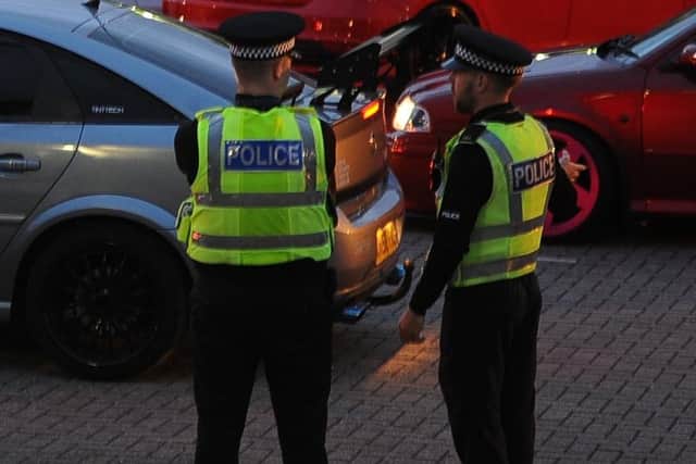 Police pictured attending a previous car meet in Oundle Road.